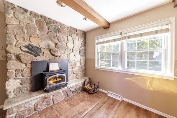a bedroom with a bed and a lamp on table