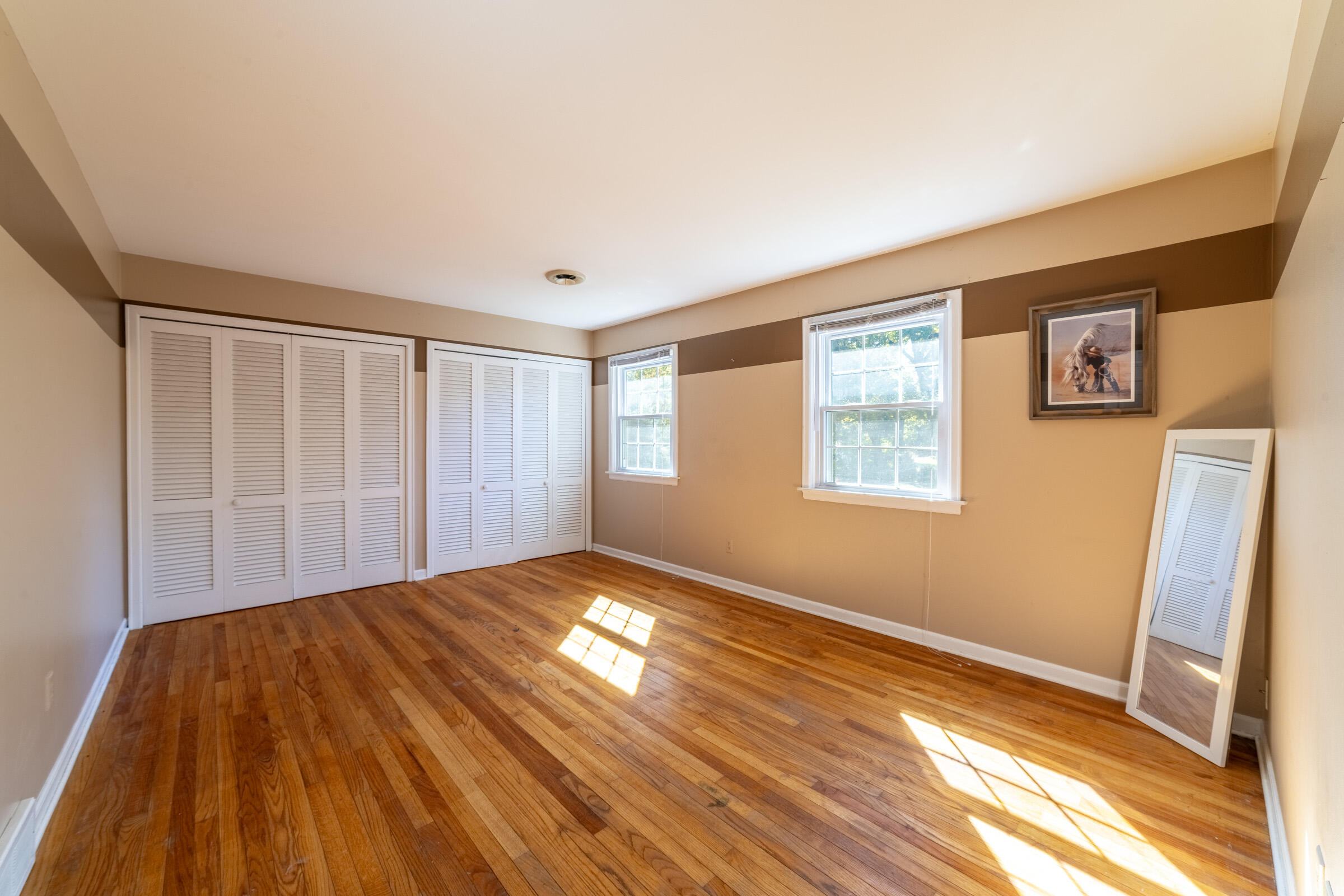 1704 Clover Lane Valparaiso, IN 46385 - Photo 26 of 40 a view of empty room with wooden floor and fan