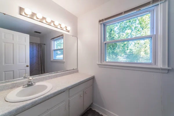 a view of a big room with windows