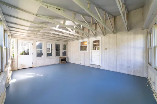 a view of an empty room with stairs