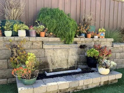 a view of a backyard with sitting area