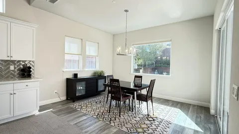 a kitchen with a table and chairs in it