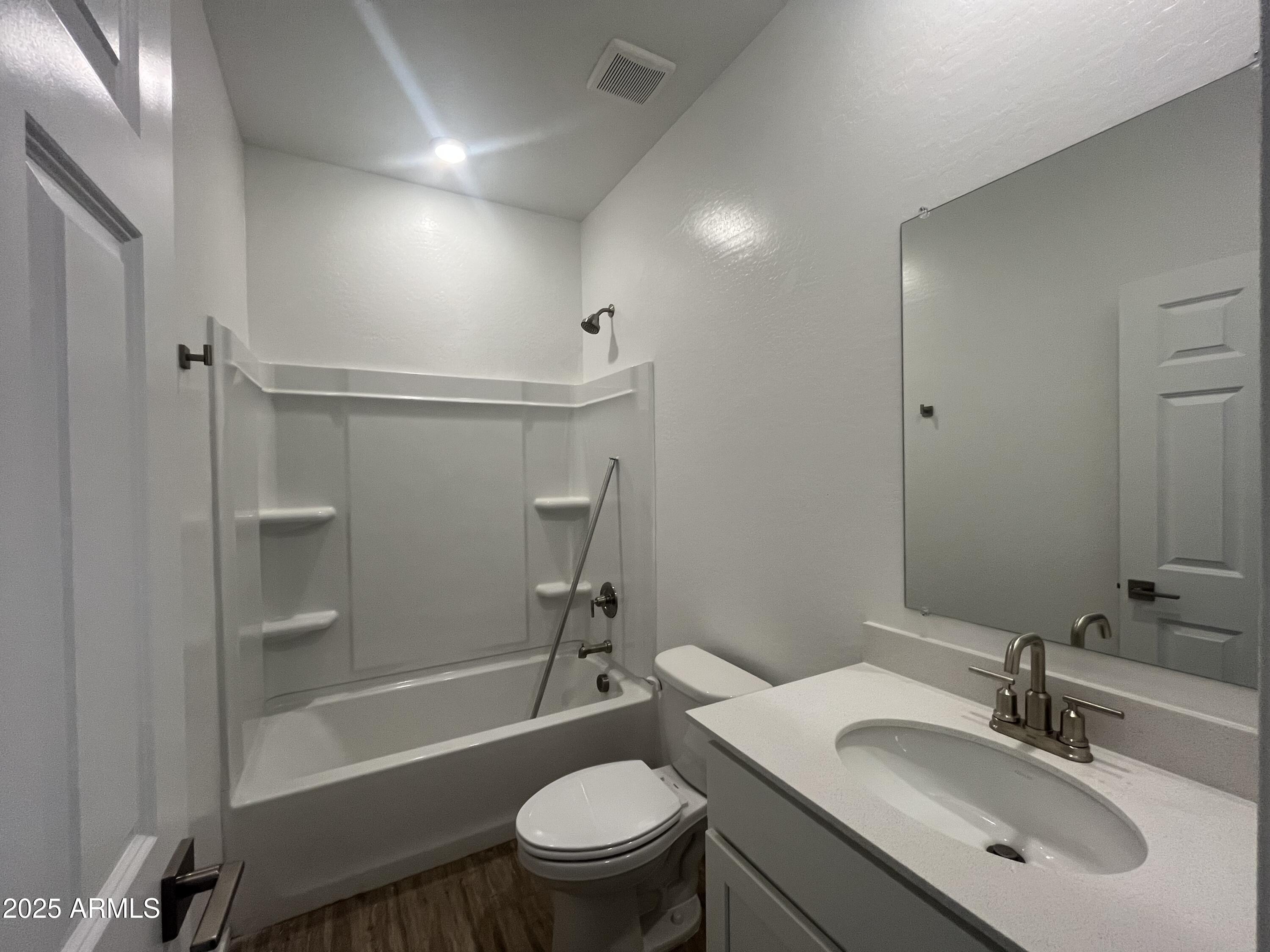 47692 West Moeller Road Maricopa, AZ 85139 - Photo 11 of 31 a bathroom with a sink a toilet and shower