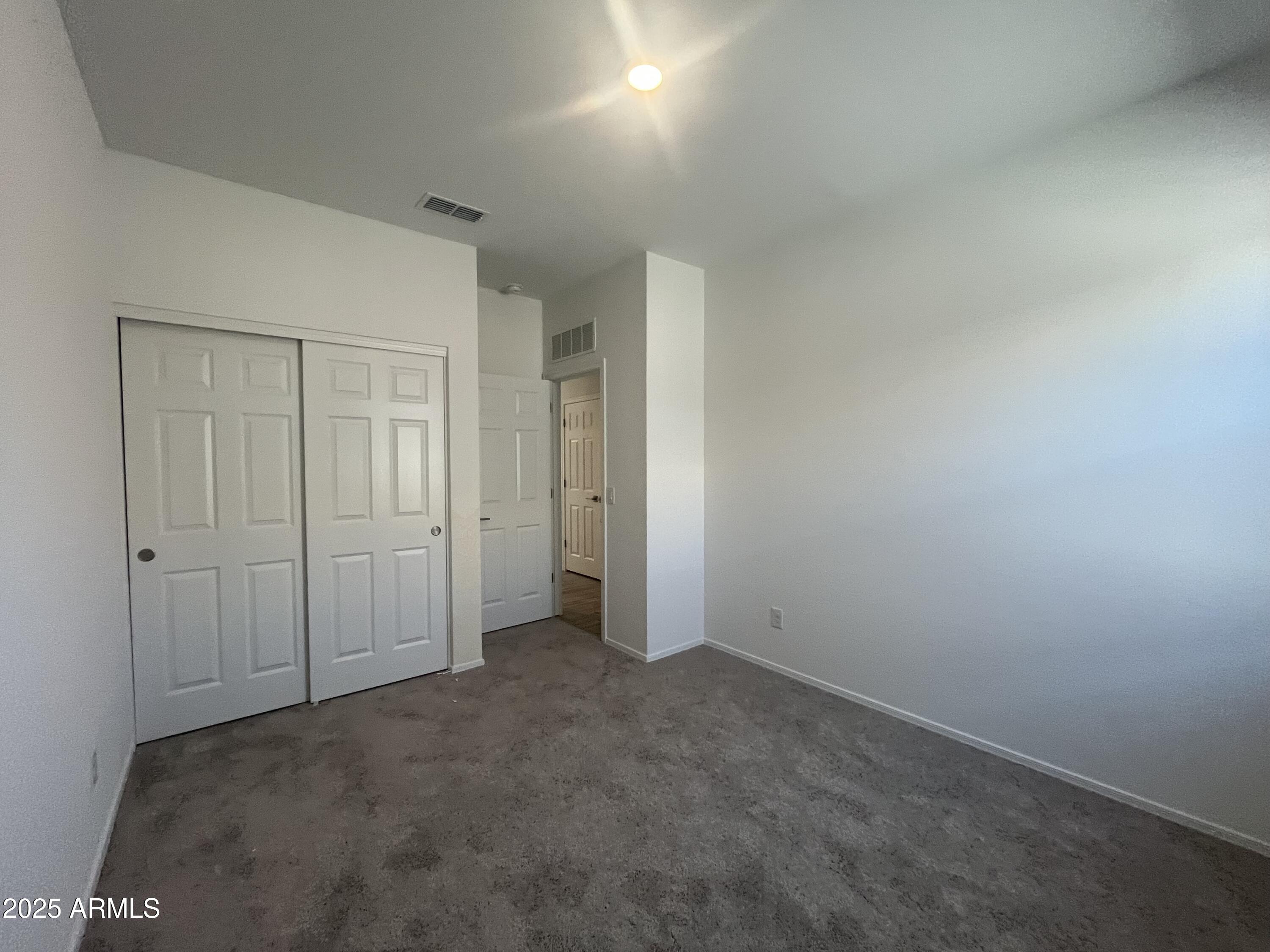 47692 West Moeller Road Maricopa, AZ 85139 - Photo 13 of 31 an empty room with closet area