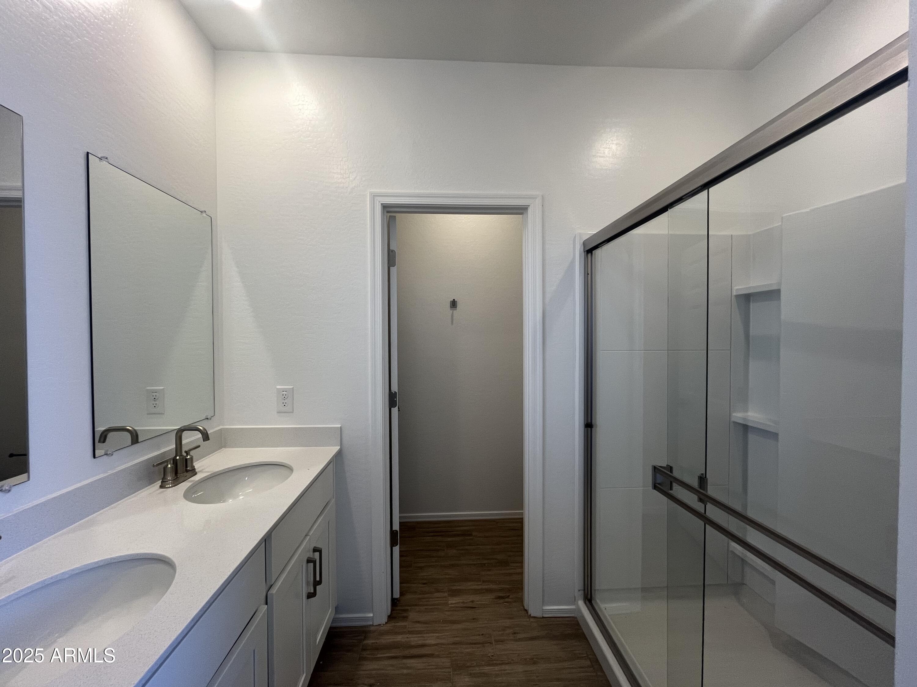 47692 West Moeller Road Maricopa, AZ 85139 - Photo 18 of 31 a bathroom with a double vanity sink mirror and shower