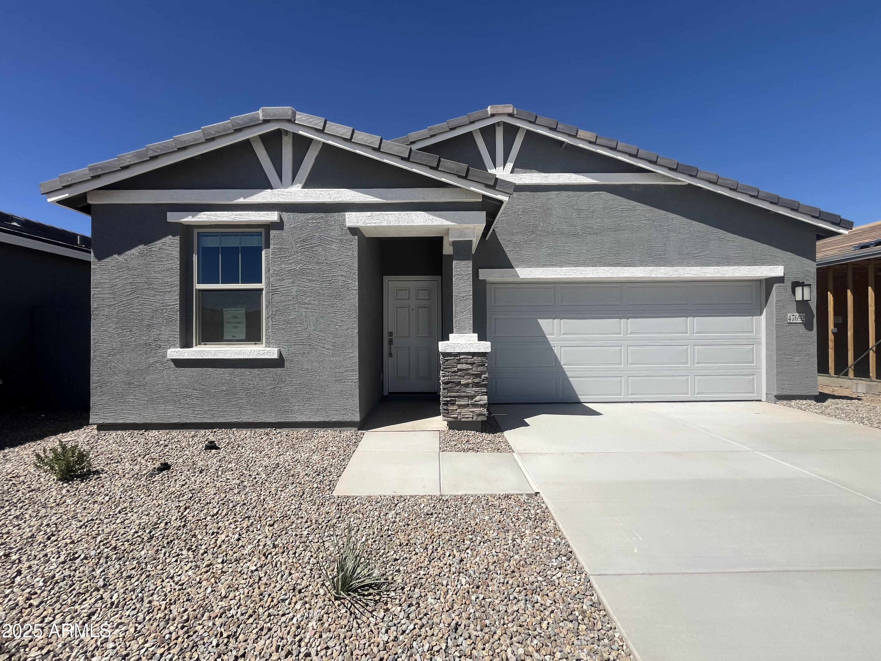 47692 West Moeller Road Maricopa, AZ 85139 - Photo 2 of 31 a front view of a house with a yard