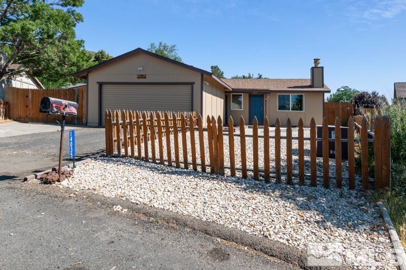 14035 Feldspar Court Reno, NV 89521 - Photo 1 of 16 a front view of a house with a garden