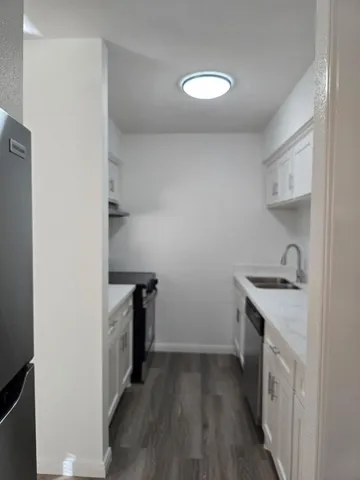 a kitchen with a stove top oven