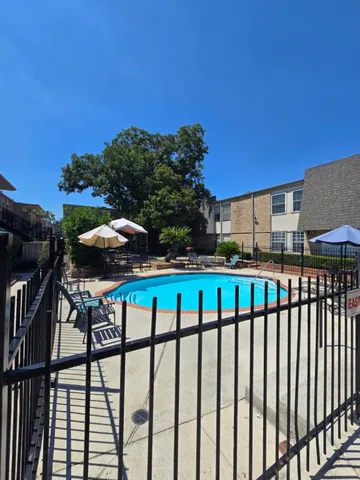 a view of a two chairs under an umbrella