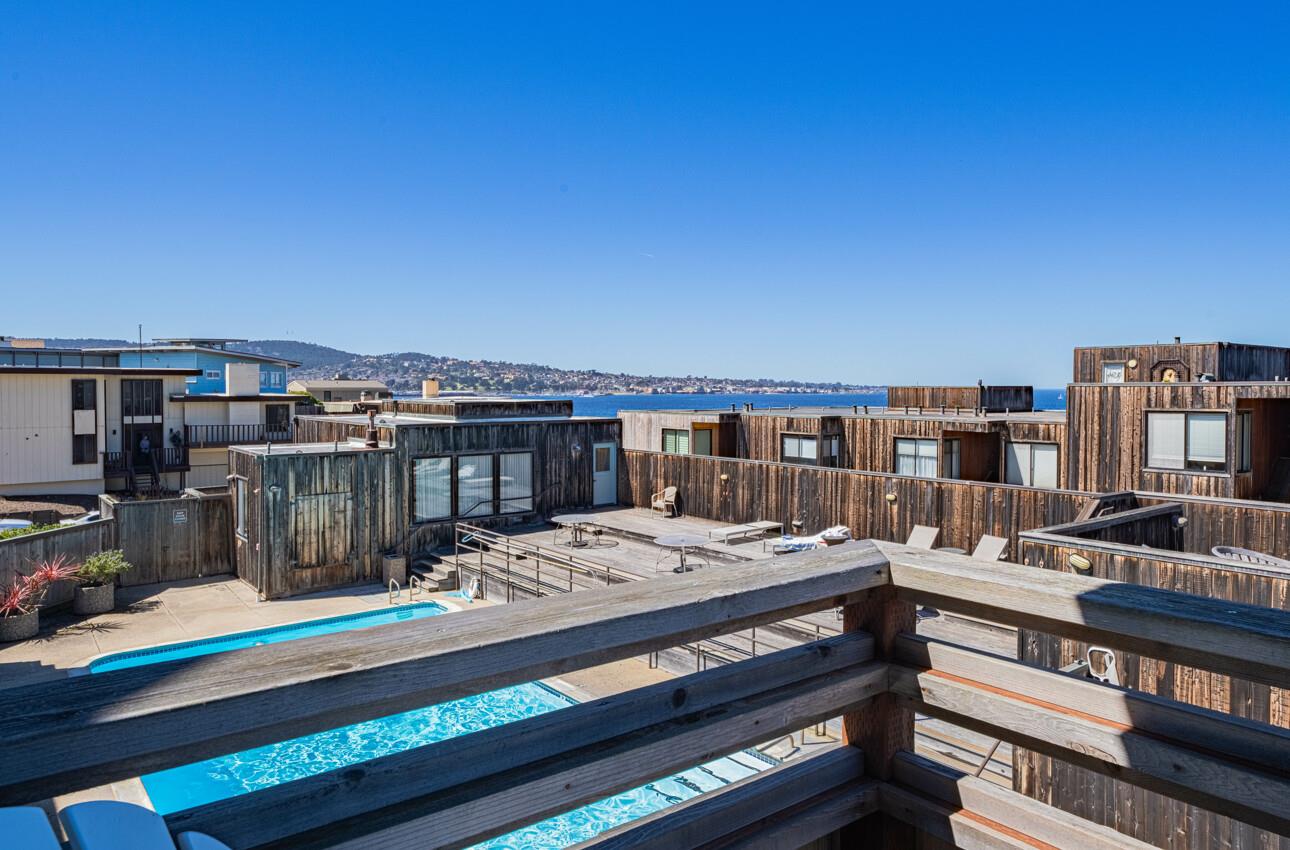 125 Surf Way, Unit 438 Monterey, CA 93940 - Photo 16 of 45 a view of a roof deck with couches and wooden floor