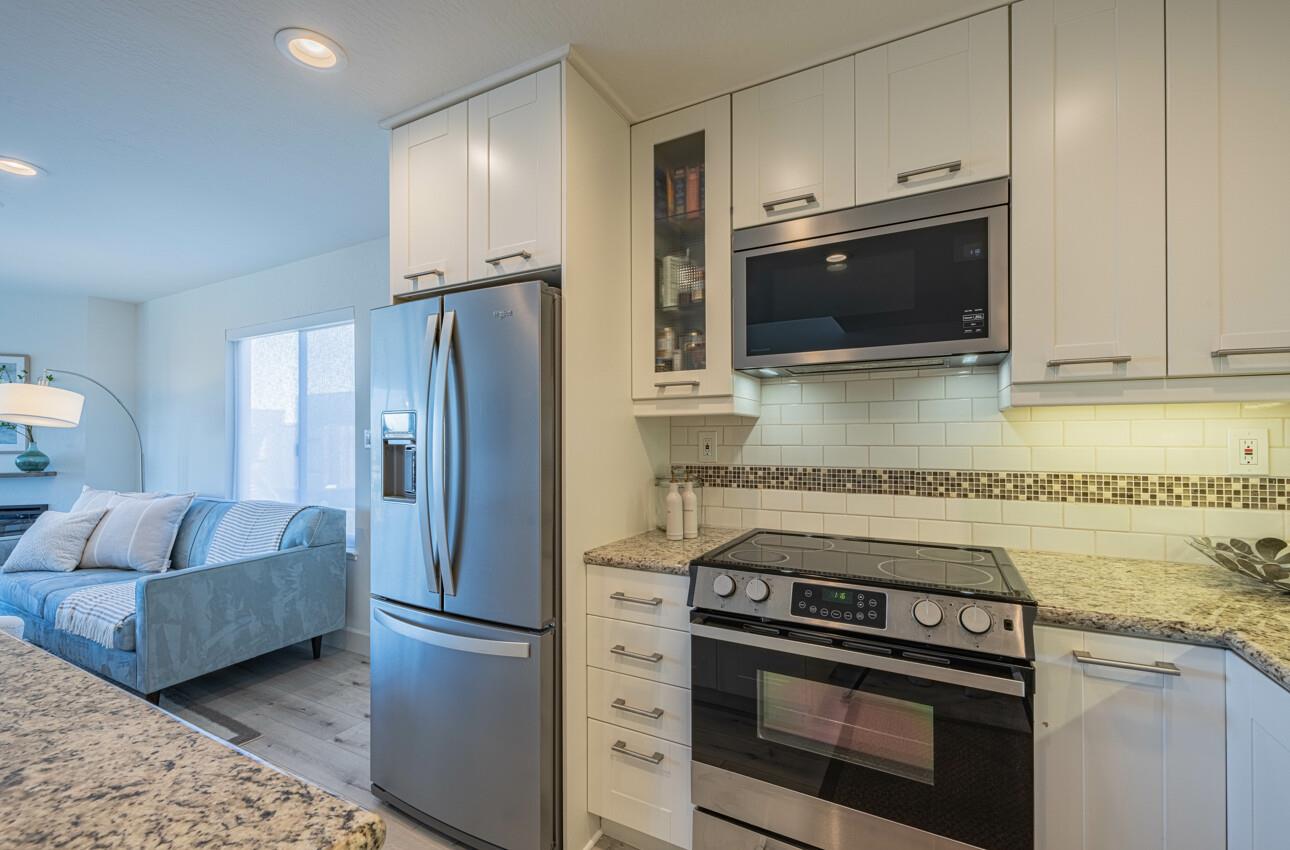 125 Surf Way, Unit 438 Monterey, CA 93940 - Photo 20 of 45 a kitchen with a stove microwave and refrigerator