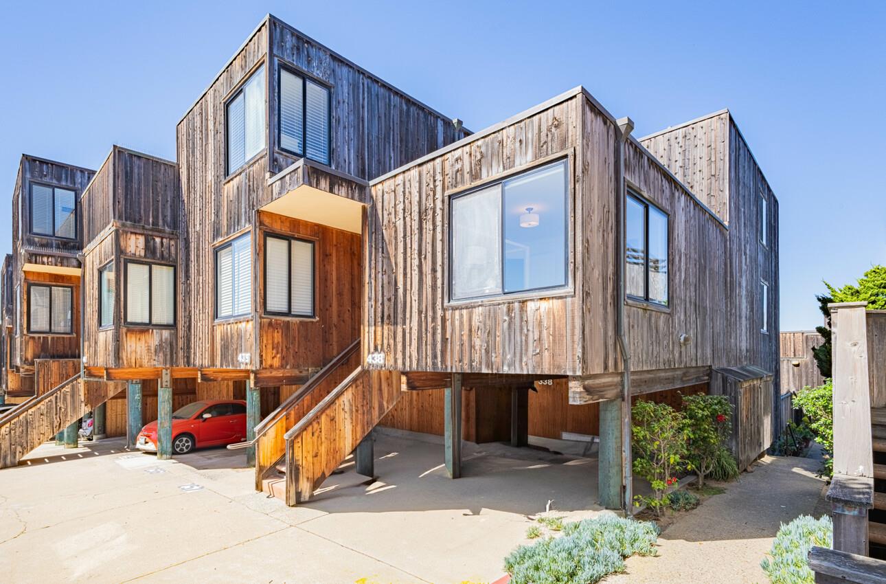 125 Surf Way, Unit 438 Monterey, CA 93940 - Photo 3 of 45 a view of a house with wooden fence