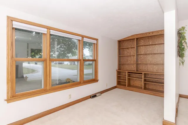 a kitchen with a refrigerator sink and cabinets