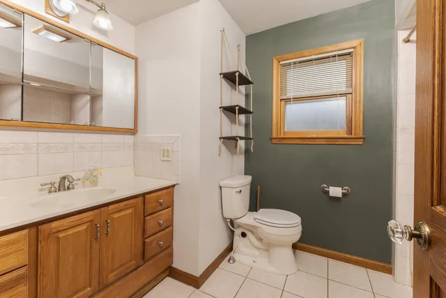 a view of an empty room with a fireplace