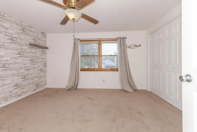 a view of a room with wooden walls