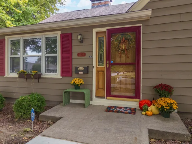 an aerial view of a house with a yard and trees