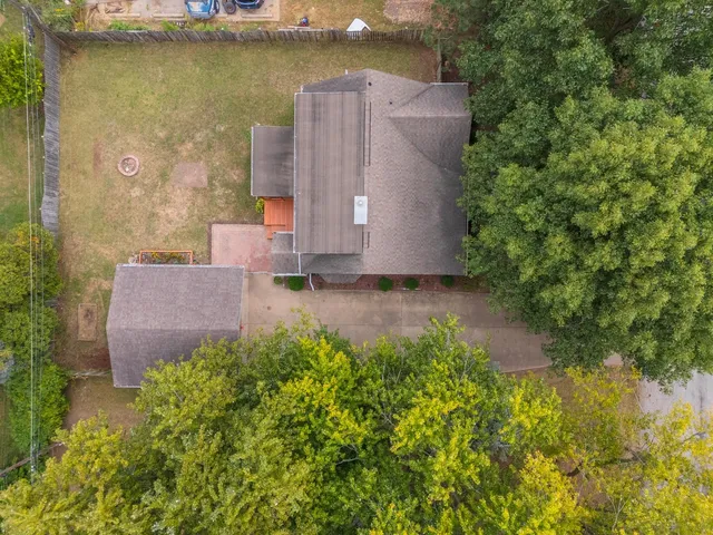 an aerial view of residential houses with outdoor space
