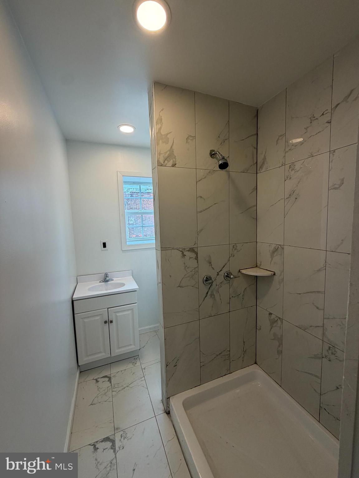 3760 North 9th Street Philadelphia, PA 19140 - Photo 3 of 17 a bathroom with a sink a toilet and shower