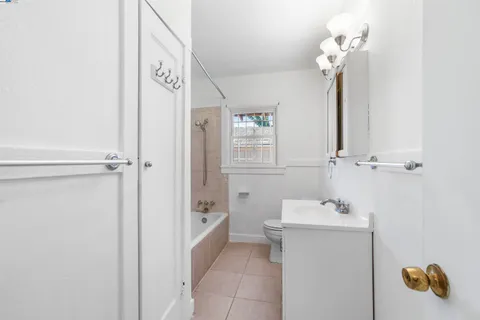 a bathroom with a sink mirror and vanity