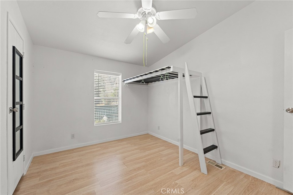 52076 Maxine Avenue Cabazon, CA 92230 - Photo 16 of 35 wooden floor in an empty room with a window