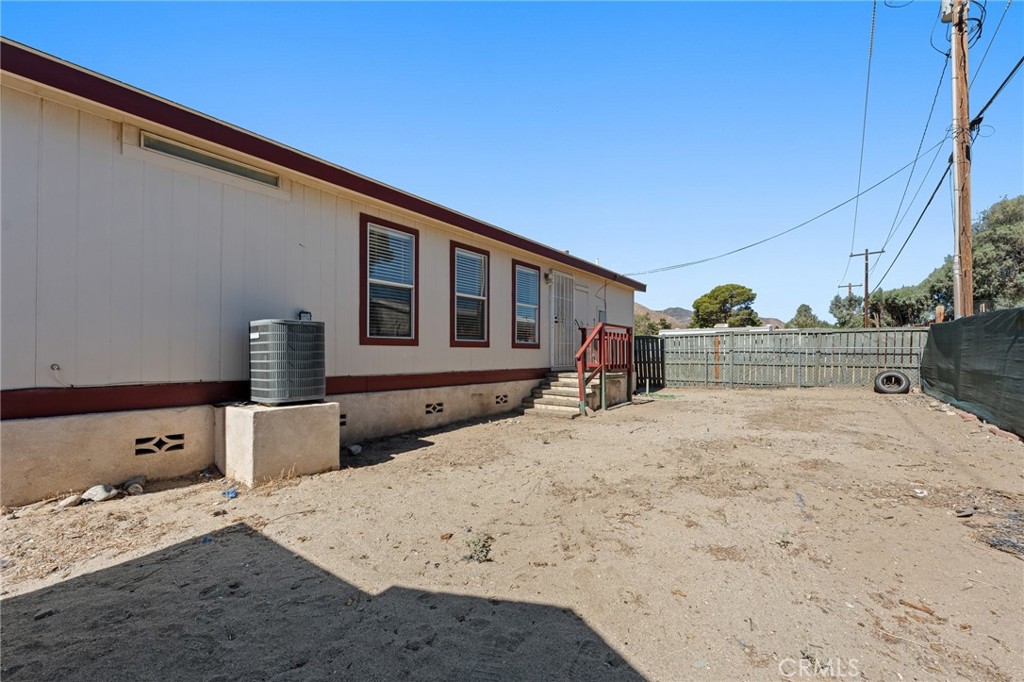 52076 Maxine Avenue Cabazon, CA 92230 - Photo 28 of 35 a front view of a house with a bed
