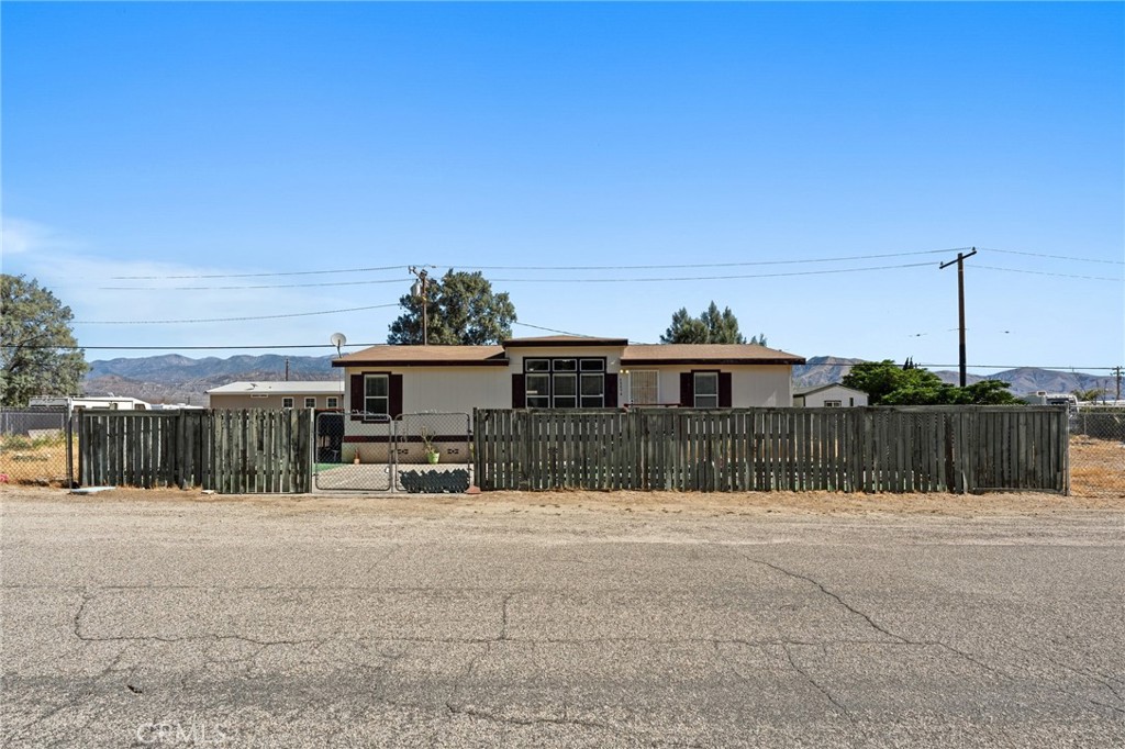 52076 Maxine Avenue Cabazon, CA 92230 - Photo 3 of 35 a view of a house with a fence