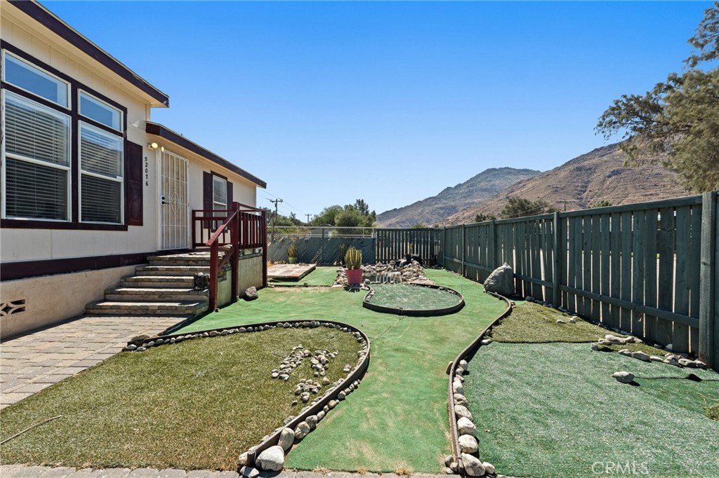 52076 Maxine Avenue Cabazon, CA 92230 - Photo 5 of 35 a view of a house with backyard and sitting area