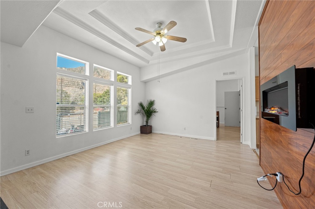 52076 Maxine Avenue Cabazon, CA 92230 - Photo 7 of 35 a view of an empty room with a window and wooden floor