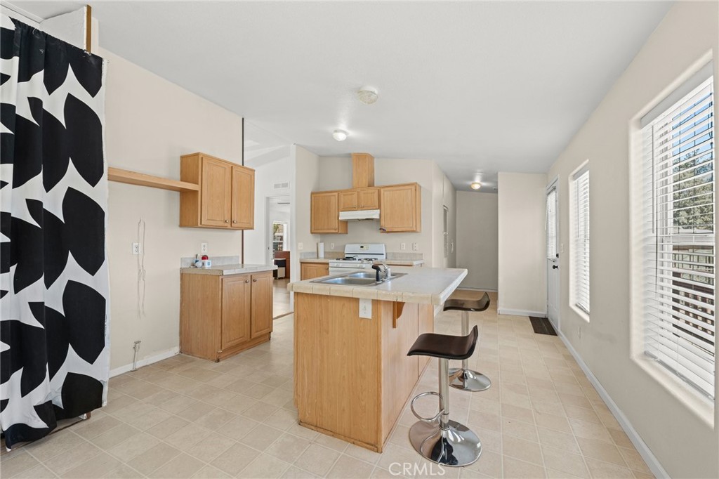 52076 Maxine Avenue Cabazon, CA 92230 - Photo 9 of 35 a view of kitchen and living room with windows
