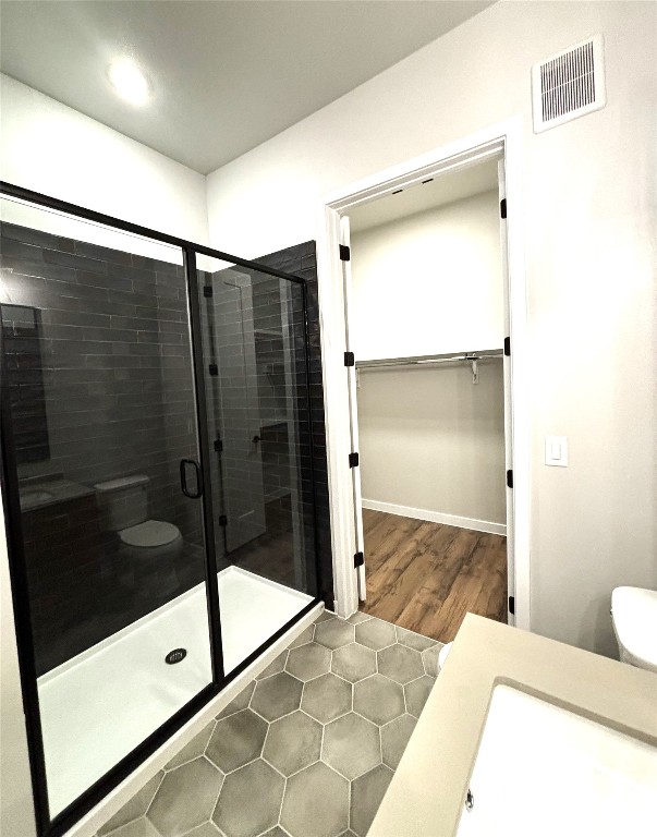 4510 Terry-O Lane, Unit 406 Austin, TX 78745 - Photo 17 of 35 a bathroom with a glass shower door and a sink