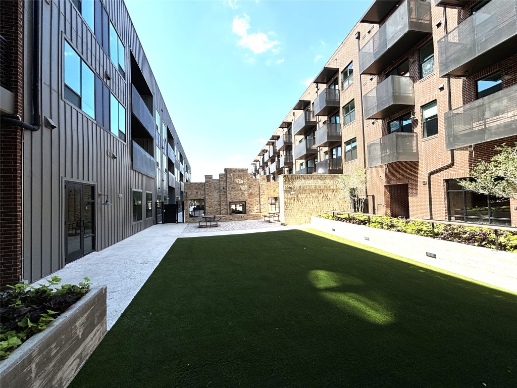 4510 Terry-O Lane, Unit 406 Austin, TX 78745 - Photo 31 of 35 a view of building with yard