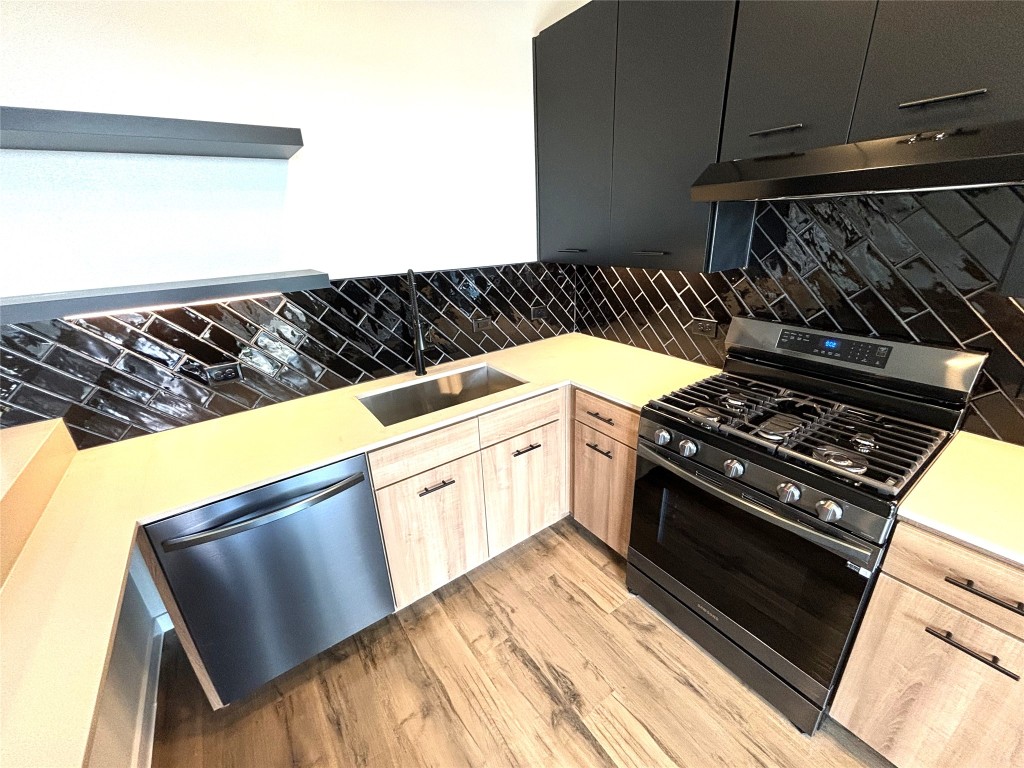 4510 Terry-O Lane, Unit 406 Austin, TX 78745 - Photo 8 of 35 a close view of a stove a microwave and a table