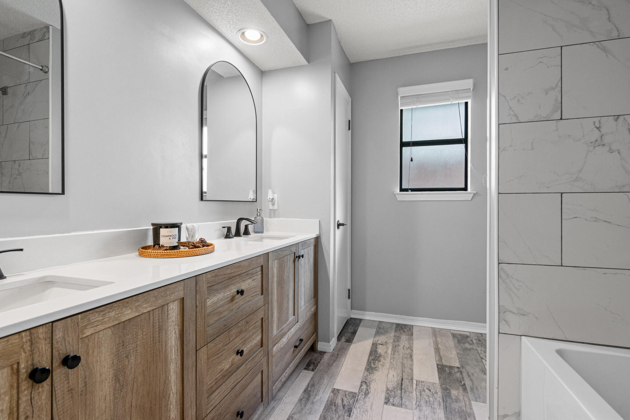 8573 Westview Lane Pensacola, FL 32514 - Photo 21 of 35 a bathroom with a double vanity sink and a mirror