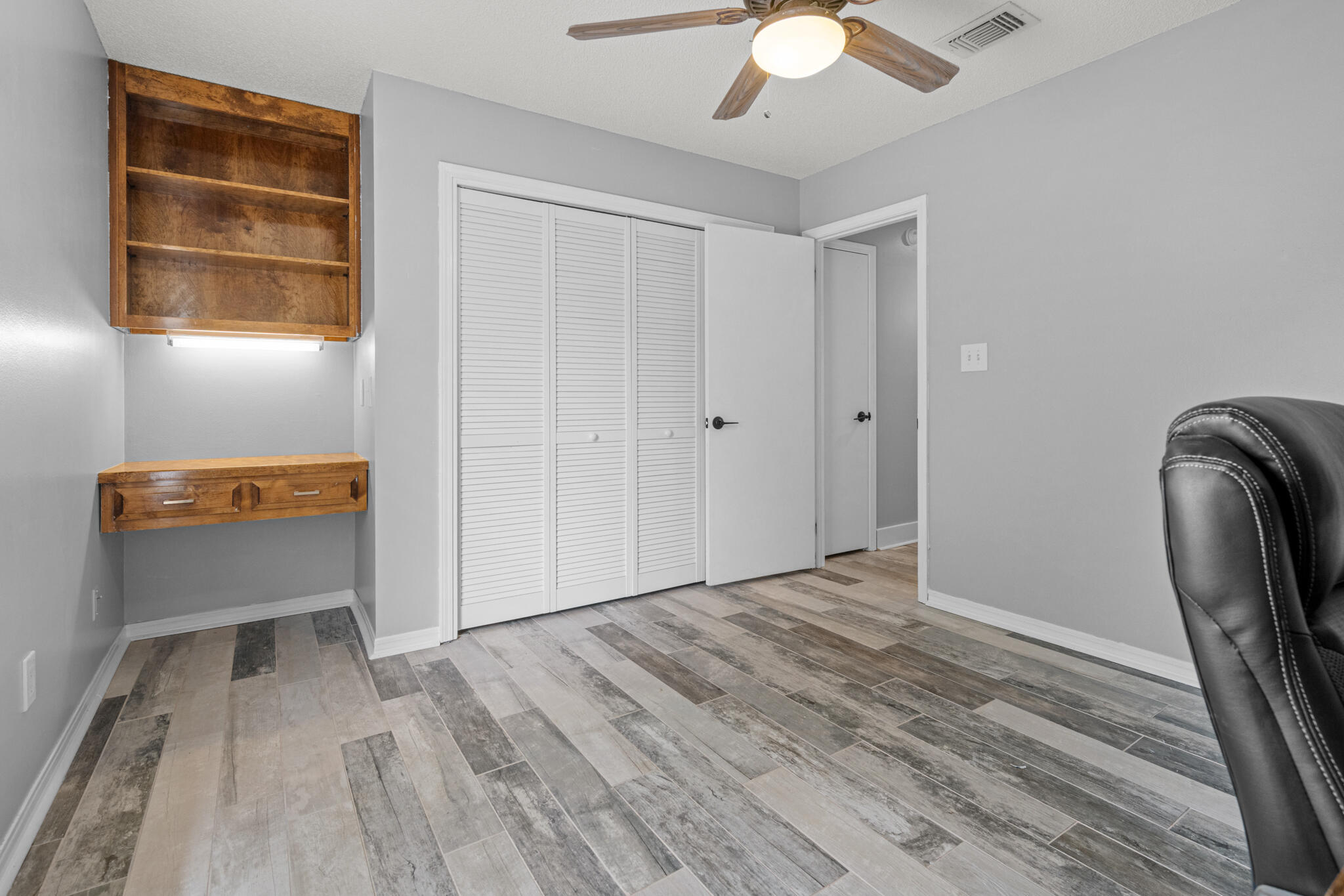 8573 Westview Lane Pensacola, FL 32514 - Photo 29 of 35 a view of room with window and wooden floor