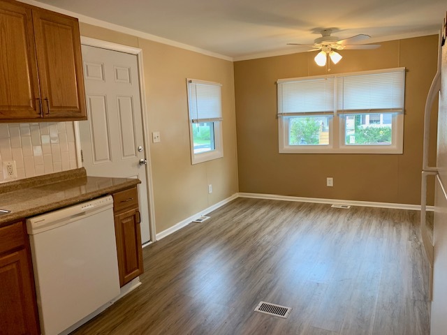 1165 Lake Terrace Road Elgin, IL 60123 - Photo 7 of 14 wooden floor in an empty room with a window