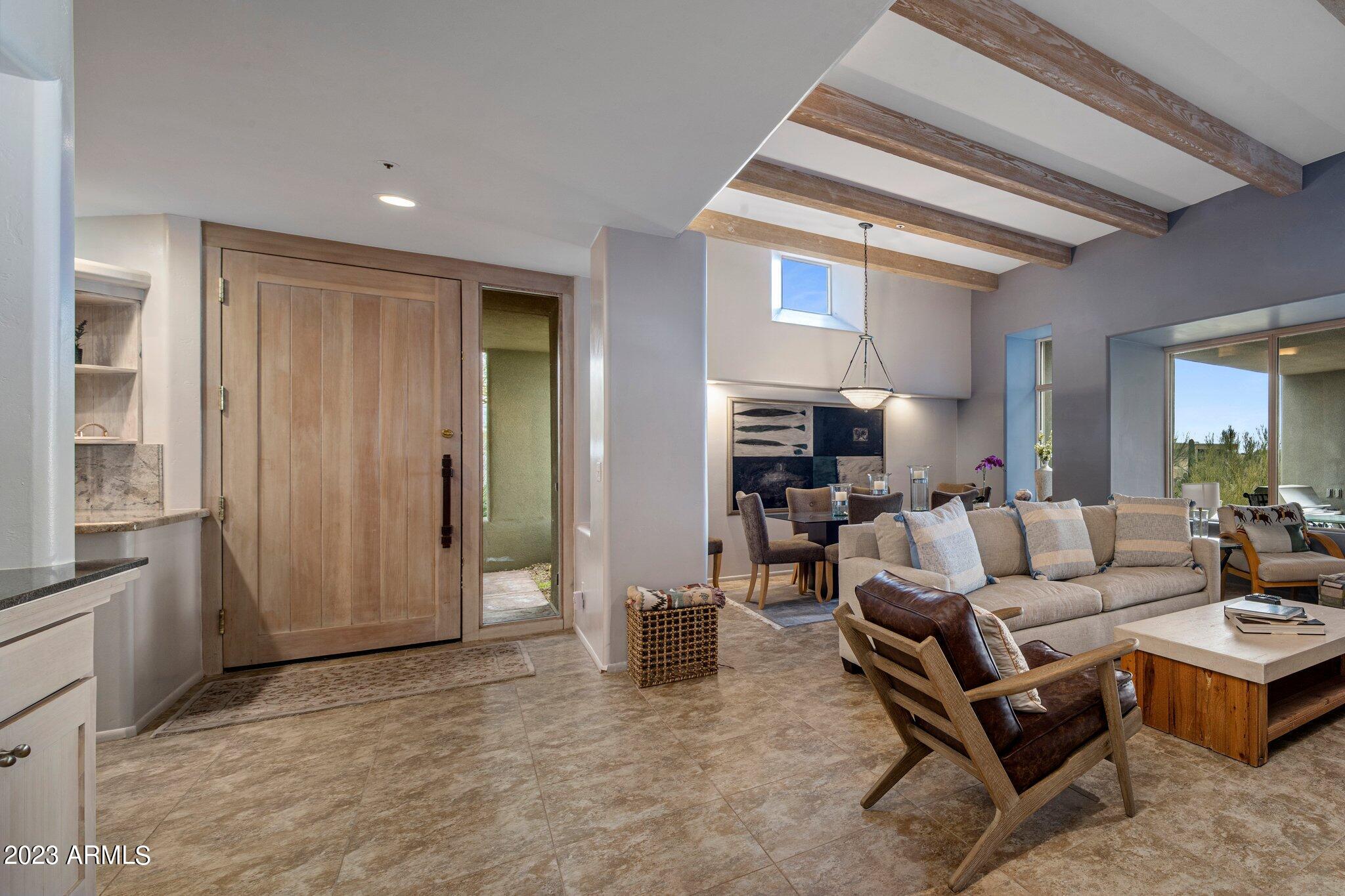 10111 East Graythorn Drive Scottsdale, AZ 85262 - Photo 4 of 14 a living room with furniture and a window