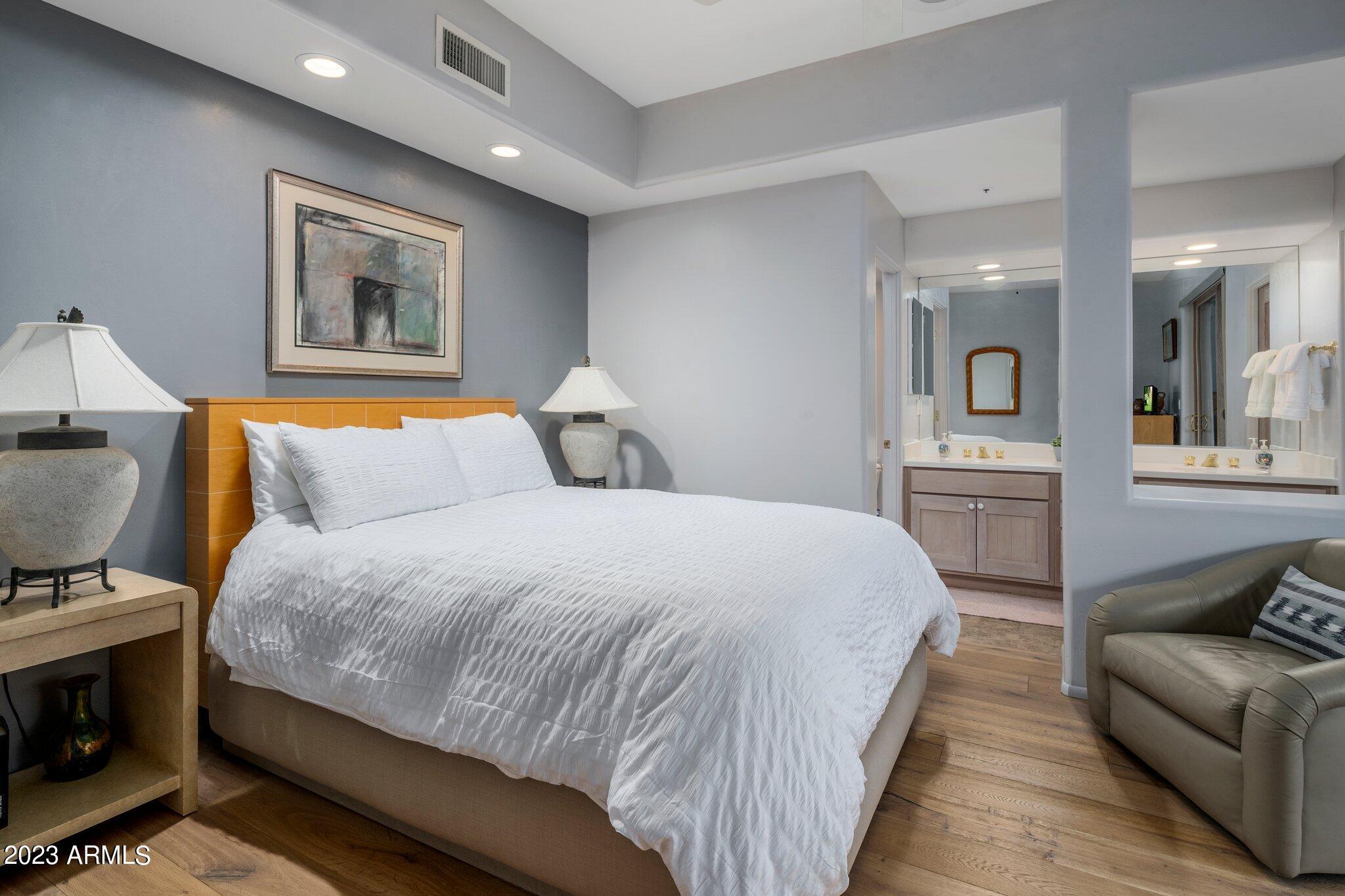 10111 East Graythorn Drive Scottsdale, AZ 85262 - Photo 7 of 14 a bedroom with a bed and a couch