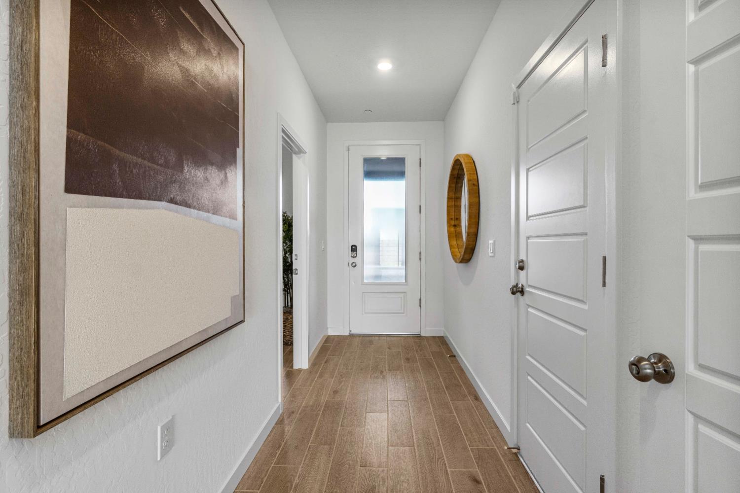 822 Traverse Drive Madera, CA 93636 - Photo 11 of 40 a view of a hallway with wooden floor