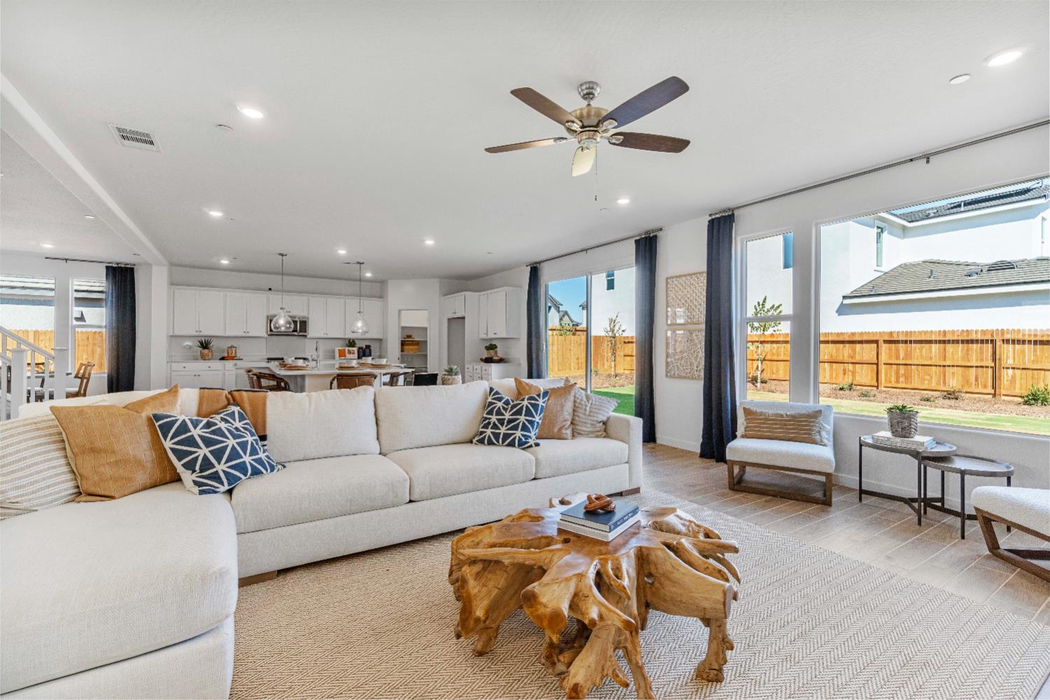 822 Traverse Drive Madera, CA 93636 - Photo 15 of 40 a living room with furniture and kitchen view