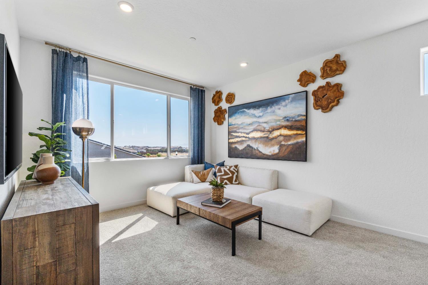 822 Traverse Drive Madera, CA 93636 - Photo 26 of 40 a living room with furniture and a large window