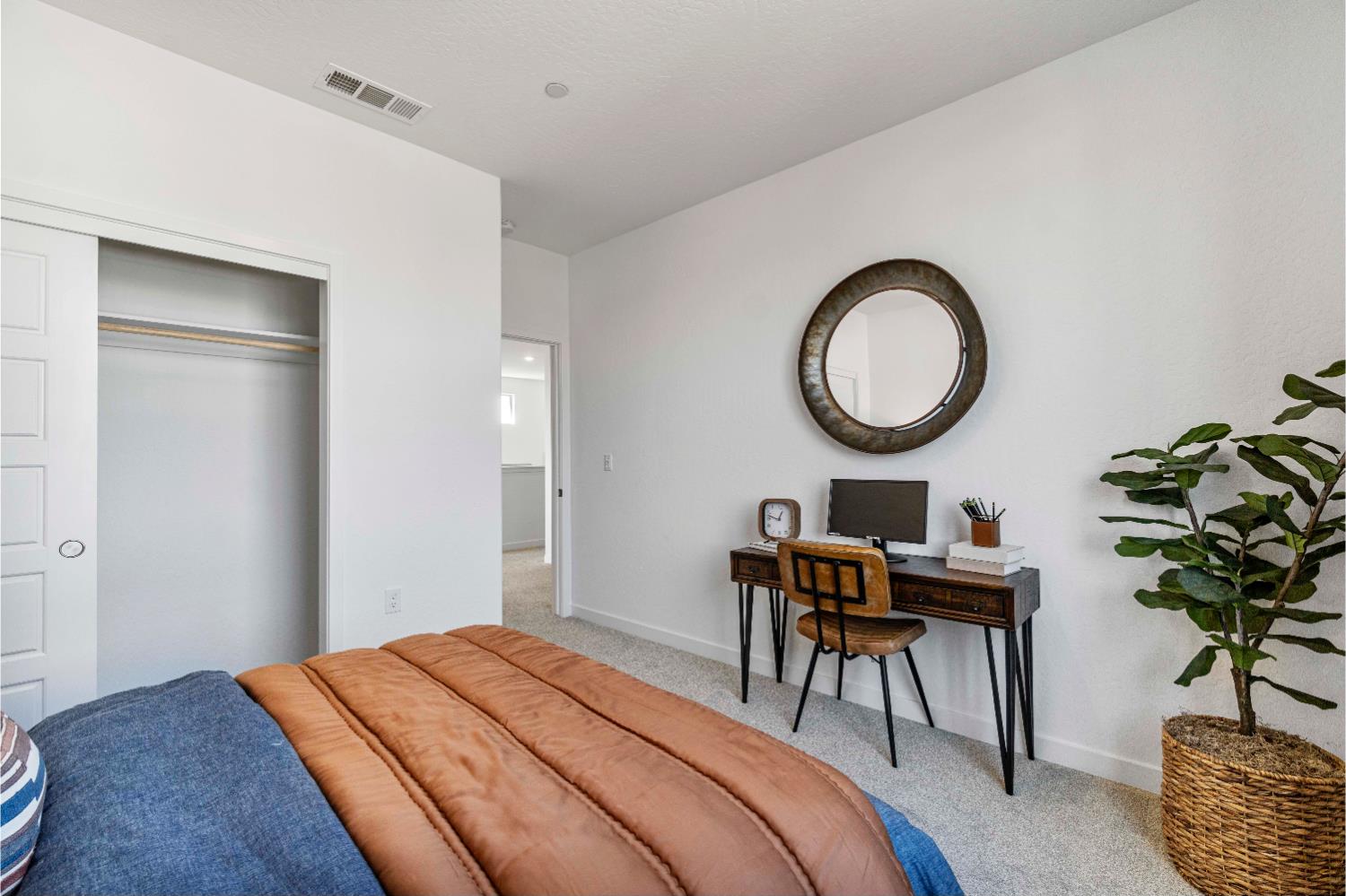 822 Traverse Drive Madera, CA 93636 - Photo 32 of 40 a bedroom with bed and a chandelier