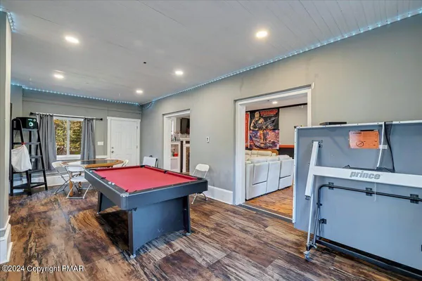 a living room with a couch a table and a flat screen tv