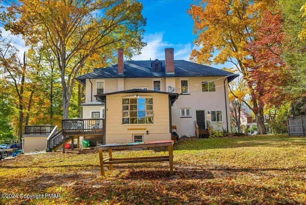 a view of a patio with a table and chairs