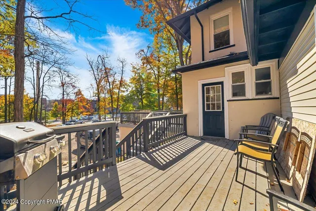 a view of a backyard with large trees