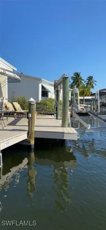 a view of a patio with couches and table and chairs