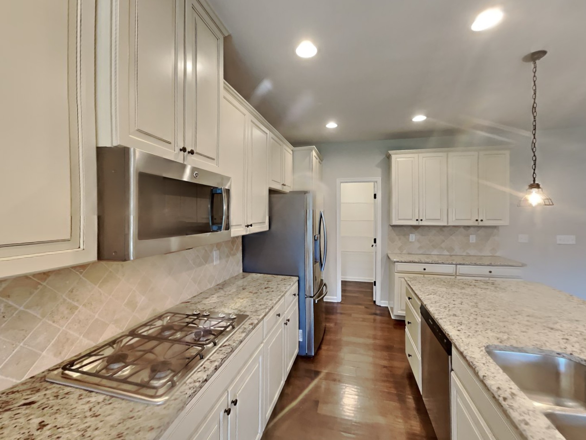 132 Hackney Lane Gallatin, TN 37066 - Photo 6 of 23 a large kitchen with stainless steel appliances granite countertop a stove a sink and a refrigerator