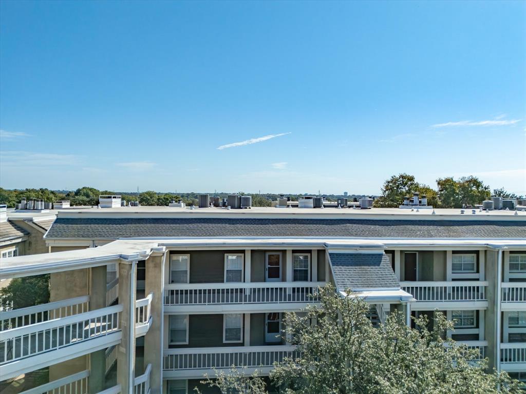 5310 Keller Springs Road, Unit 332 Dallas, TX 75248 - Photo 14 of 38 a view of a big building with big yard and plants