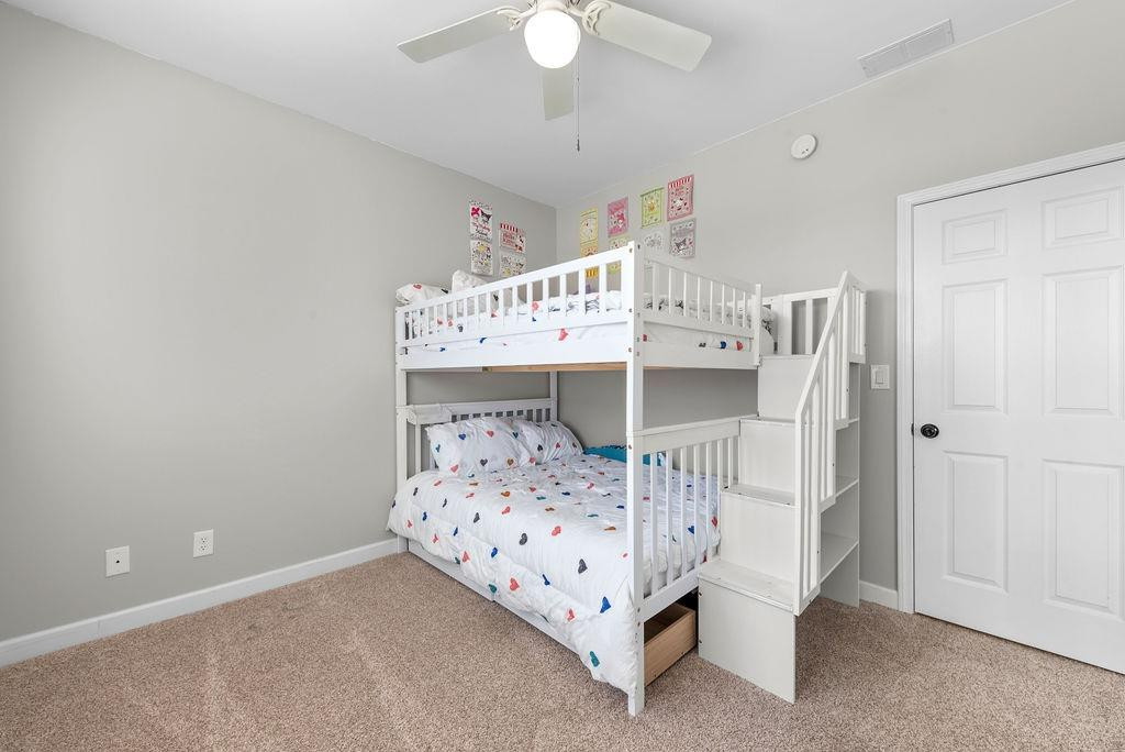 21 B Edinburgh Street Valparaiso, IN 46385 - Photo 14 of 17 a bedroom with a bed and a chandelier