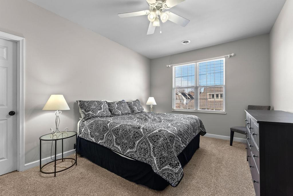 21 B Edinburgh Street Valparaiso, IN 46385 - Photo 10 of 17 a bed room with a bed and a chandelier