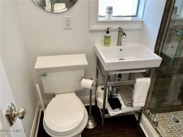 a bathroom with a toilet and a sink